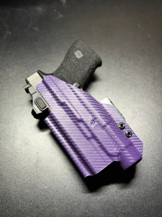 Custom-molded Kydex holster with RMR cut, compatible with popular reflex sights.